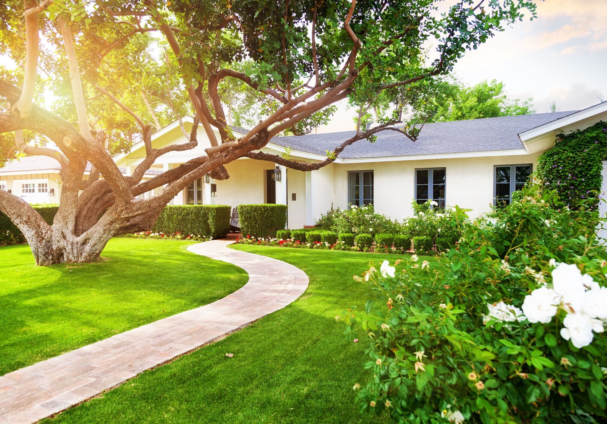 Pathway leading to cozy white house